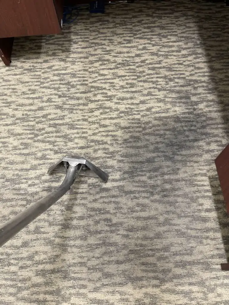 Carpet extraction wand cleaning a commercial office carpet