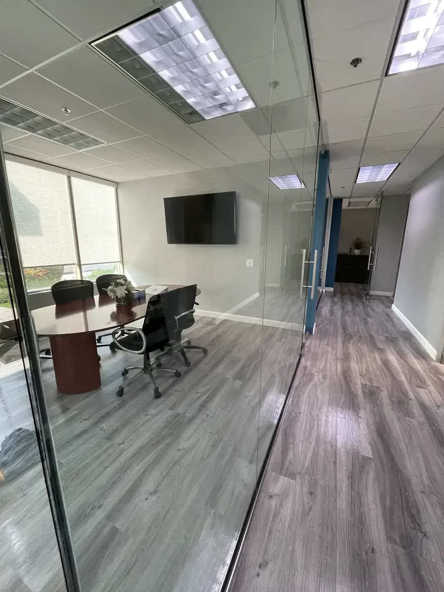Streak-free glass walls around a conference room after window cleaning